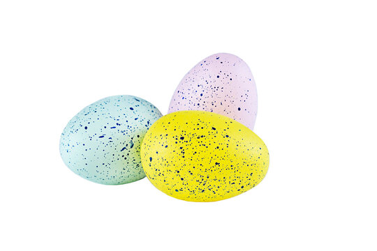 Yellow, pink and blue easter eggs close up, isolated on white