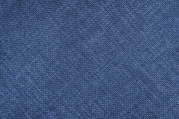 Jacquard woven upholstery, blue coarse fabric texture with diagonal weave lines. Textile background, furniture textile material, wallpaper, backdrop. Cloth structure close up.