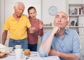 Daughter with his father scolded son in law at home. High quality photo