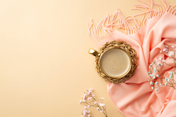 Hello spring concept. Top view photo of mug of fresh coffee on rattan serving mat pink soft plaid and gypsophila flowers on isolated pastel beige background with copyspace