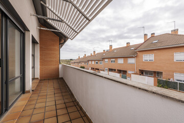 Open terrace of a house in a single-family residential building of various heights with clay floors...