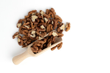 scoop with walnuts isolated on white background