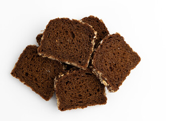 slices of rye bread on white background, top view
