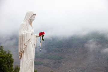 Statue of the Blessed Virgin Mary on Mount Podbrdo, the Apparition hill overlooking the village of...