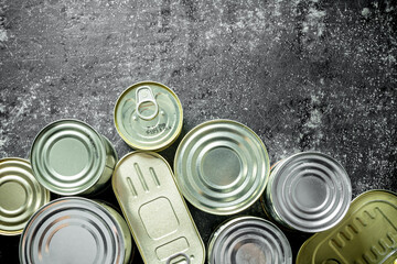 Fototapeta premium Group of closed tin cans with canned food.