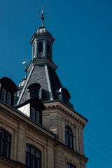 Fototapeta na wymiar View of roof and facades of danish classical danish architecture in Copenhagen, Denmark