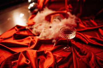 Coupe glass of champagne at red glamour background on valentines day