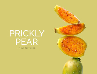 Creative layout made of prickly pear on the green background. Flat lay. Food concept. Macro...