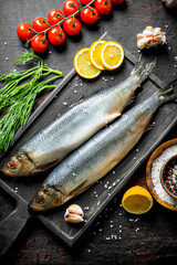 Salted herring with tomatoes, lemon and dill.