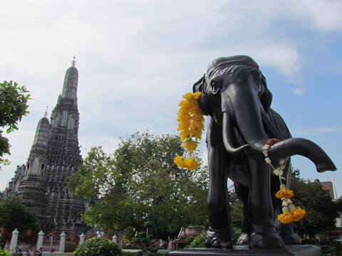 Elephant statue in front of Wat Arun, a Buddhist temple, in Bangkok, Thailand