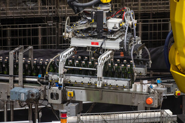 Production of cremant sparkling wine in Burgundy, France. Automatically powered bottling lines on factory.