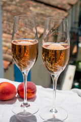 Summer party, drinking of French brut champagne sparkling wine in glasses in yacht harbour of Port Grimaud near Saint-Tropez, French Riviera vacation, France