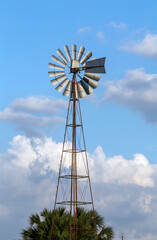 Windmill for pumping water on a rural property in the interior of the state of Sao Paulo, Brazil - obrazy, fototapety, plakaty