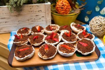 homemade tartlets filled with tiramisu and strawberry slices