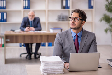 Two male colleagues working in the office