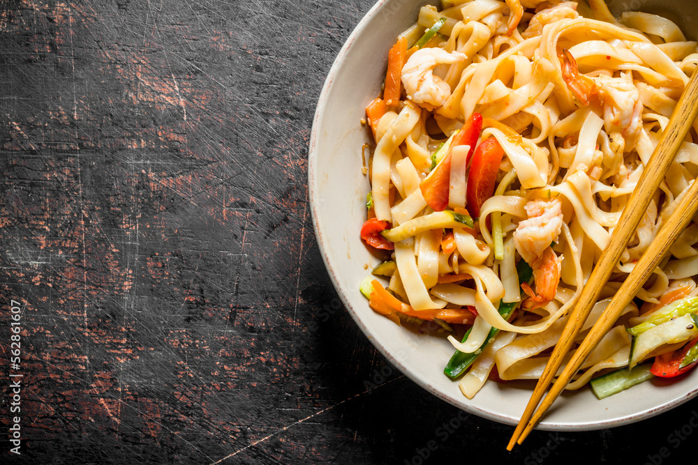 Sticker noodles with shrimp and vegetables.