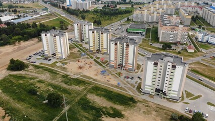A new recently built neighborhood of apartment buildings. Drone video.