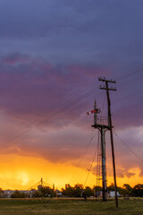 Fototapeta premium railway signal with impressive stormy sky at sunset. vertical format