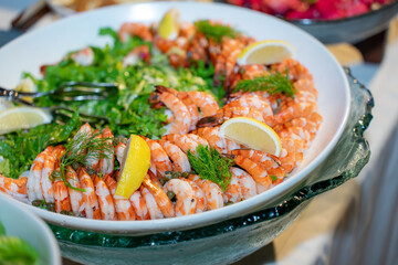 Boiled fresh shrimp salad served with lemon.