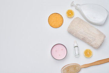 some items on a white surface with lemons, toothpasy and other things to be used for oral care