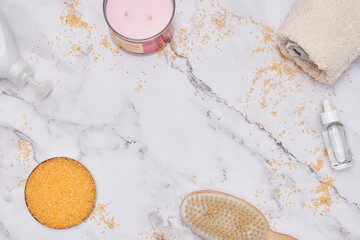 some hair products on a white marble surface with gold flakes and other items to be used in the process