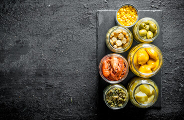 Homemade preserved food on a stone Board.