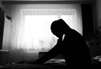 Unhappy woman at home suffering from depression, sadness, divorce, loneliness.	 - obrazy, fototapety, plakaty