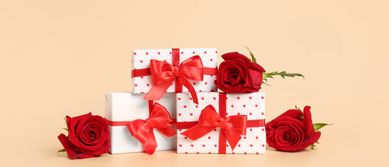 Gift boxes and roses on beige background. Valentine's Day celebration