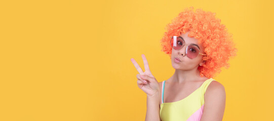 having fun. child wear sunglasses and swimsuit. teen girl with orange hair. summer beach fashion. Funny teenager child on party, poster banner header with copy space.