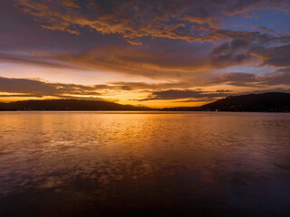 After the rain sunrise waterscape with clouds