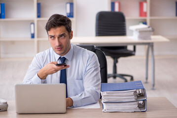 Young male employee working in the office