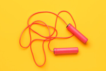 Skipping rope on yellow background