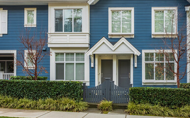 Beautiful brand new contemporary house in a Canadian neighbourhood. Front doors with a pretty porch and garden