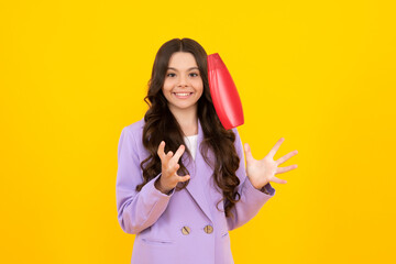 Teenager child girl showing bottle shampoo conditioners or shower gel. Hair cosmetic product. Bottle for advertising mock up copy space. Happy teenager, positive and smiling emotions of teen girl.