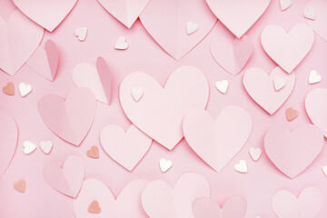 Composition with paper hearts on pink background. Valentines Day celebration