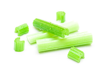 Fresh Chopped Celery Sticks and Slices with Water Drops Isolated on White Background. Vegan and Vegetarian Culture. Raw Food. Healthy Diet with Negative Calorie Content