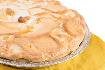 Whole Fresh Lemon Meringue Pie on a Kitchen Counter