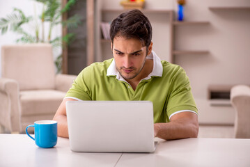 Young man working from home during pandemic