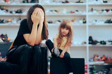 Stressed Mom Going Shopping for Shoes with her Daughter. Mother feeling upset with the pricey...