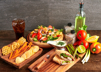Caesar salad and pita bread with fries for dinner