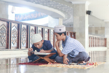 Muslim boys recite the Koran in the mosque