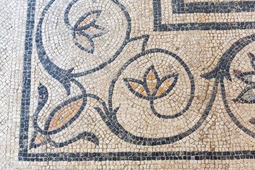 Original Roman mosaic at teh Roman Theatre of Orange and Triumphal Arch of Orange, France