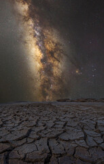 Drought-cracked soils, dry-cracked lakes, and night sky which star milky way