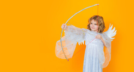 Angel kid shoots a love arrow from a bow on Valentines Day. Panoramic banner wide poster horizontal...