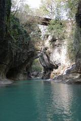 Fototapeta na wymiar Beautiful canyon with green water at Martvili Canyon the famous tourist spot