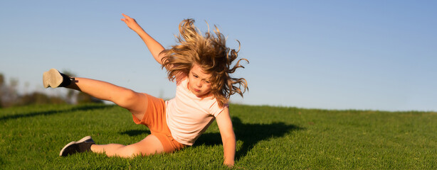 Kid runs through the spring grass and falling down. Moment of the fall down. Little child tripped and falls down. The moment of the fall. Spring and kid. Wide photo banner for website header. - obrazy, fototapety, plakaty