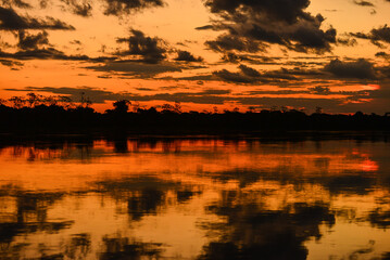 Fototapeta premium Dramatic sunset on the Guaporé - Itenez river, near the remote village of Remanso, Beni Department, Bolivia, on the border with Rondonia state, Brazil