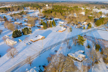 American small town in South Carolina US after snowfall accompanied by an amazing aerial view of snow landscape.