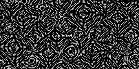 Seamless hand drawn geometric concentric circles pattern. Abstract barnacle or coral sea life motif white stripes on black background. Woodcut sun burst texture in a trendy doodle line art style.