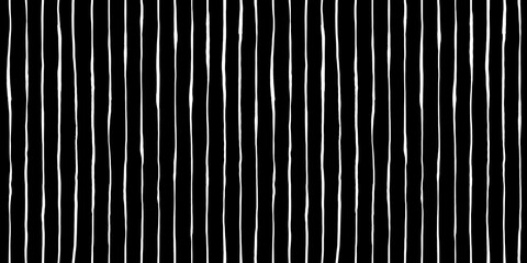 Seamless hand drawn vertical pinstripe pattern made of fine wonky white stripes on black background. Abstract simple classic blender motif with linocut print texture in a trendy doodle line art style. - obrazy, fototapety, plakaty